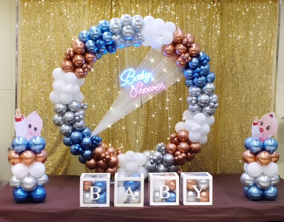 baby shower with golden curtains